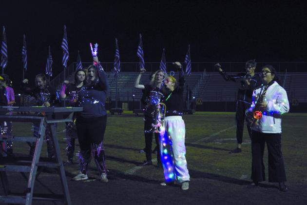 Members of the Savage Pride Marching Band chant to the "Fight Song" after giving one last performance and light show for the year. This was a special performance of the patriotic medley set to fireworks for Veterans Day on Nov. 11 - something Tecumseh Band Director John Outon said has been a dream of his. They also honored the veterans in the audience. Countywide &amp; Sun/Natasha Dunagan