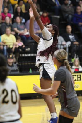 Tecumseh's Janya Bruner tries for a three-pointer in their first home game, Dec. 10. The Lady Savages beat Ada, 51-19. Countywide &amp; Sun/Natasha Dunagan