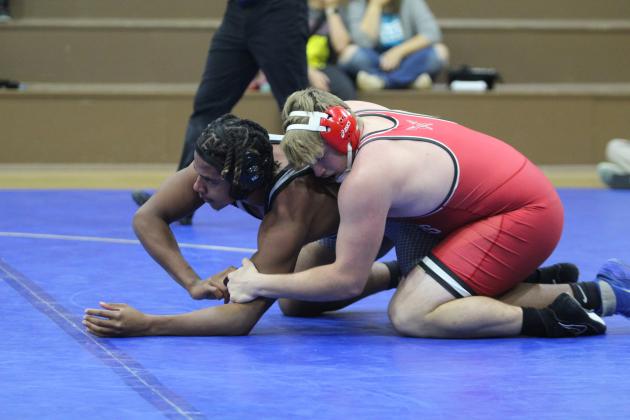 Bethel's Jakeb Miller tries to break out of a hold by McLoud's Kade Lynch in the 215 weight class during the Dec. 3 Bethel dual. Lynch won by decision. McLoud won the season-opening event, 57-16. Countywide &amp; Sun/Natasha Dunagan
