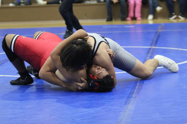 McLoud's Julius Simmons tries to keep Bethel's Alex Barnett from pinning him in the 285 weight class during the Dec. 3 Bethel dual. McLoud won the season-opening event, 57-16. Countywide &amp; Sun/Natasha Dunagan