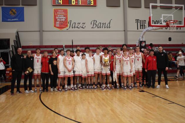The Dale Pirates pose after winning the Boomarang Classic Basketball Tournament on Dec. 14. During the three-day Dale tourney, they beat Byng, 95-30; wiped out Washington, 66-44; and overcame Oklahoma Christian School, 69-45. Countywide &amp; Sun/Natasha Dunagan