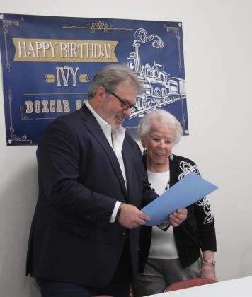 Shawnee Mayor Eric Stephens reads a proclamation in honor of "Boxcar Baby" Ivy Winter's 95th birthday during a party thrown by the Pottawatomie County Historical Society Board of Directors on Dec. 12. Winter was born on a boxcar in Shawnee on Dec. 14, 1929. Countywide &amp; Sun/Natasha Dunagan