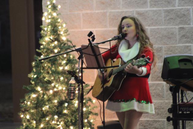 Miranda Mulkey performs during the Carols &amp; Cocoa event held at Woodland Veterans Park on Dec. 19. The IBC Ensemble, Martin Kamm, and Dr. Mitch Wolf also sang that evening, and free cocoa was provided by the Shawnee Parks and Recreation employees. Countywide &amp; Sun/Natasha Dunagan