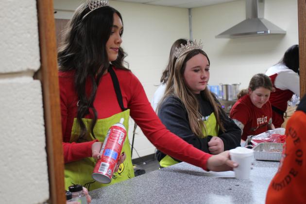 Miss Frontier Days Jalee Meyers and Miss Junior Frontier Days Elyssa Elliott serve free cocoa in Whoville, held in the Tecumseh City Hall Auditorium on Dec. 5. Countywide &amp; Sun/Natasha Dunagan