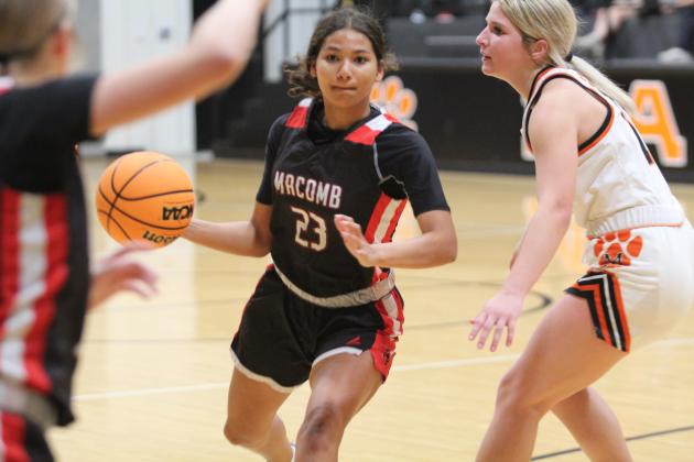 Macomb junior McKenzie Brummett looks to pass during the Dec. 9 game at Maud. The Lady Tigers won, 49-41. Countywide &amp; Sun/Natasha Dunagan