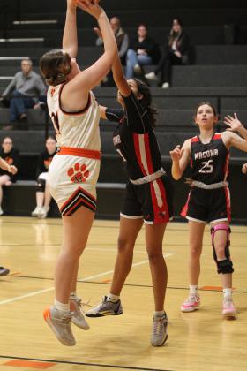 Maud's Jaycee Pack sinks her jumper despite pressure from Macomb's McKenzie Brummett during the Dec. 9 home game. The Lady Tigers won, 49-41. Countywide &amp; Sun/Natasha Dunagan