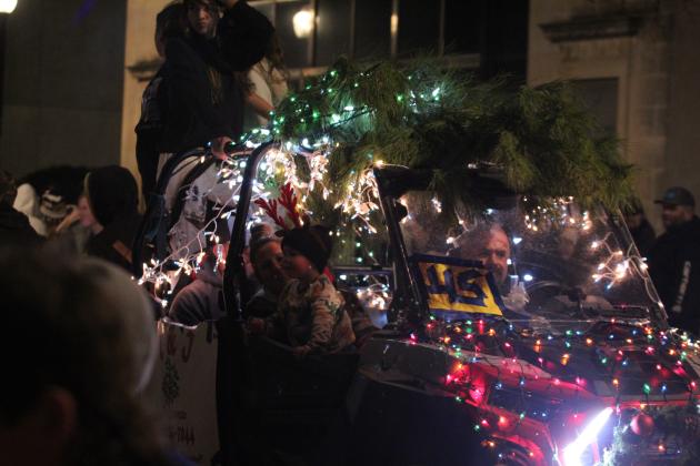 A tree is strapped on top of the C &amp; J Tree Services parade entry in the Shawnee Parade of Lights on Dec. 13. This year's parade theme was "A Griswold Christmas." Countywide &amp; Sun/Natasha Dunagan