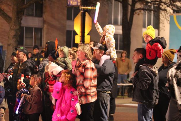 Despite the cold, families stand along Main Street to watch the Shawnee Parade of Lights on Dec. 13. Countywide &amp; Sun/Natasha Dunagan