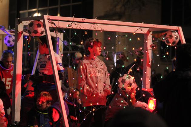 Kids from a youth soccer program ride in the Shawnee Parade of Lights on Dec. 13. Countywide &amp; Sun/Natasha Dunagan