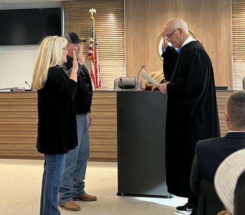 County Treasurer Rachelle Flewallen and Dist. 2 County Commissioner Greg Rush were also sworn in by Justice Combs. Not pictured, Court Clerk Valerie Ueltzen was sworn in for another term in office, as well. Photo provided.