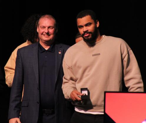 Potawatomi Fire Guard and TBL co-MVP Deshawn Munson receives his 2024 TBL National Championship ring from Head Coach Mark Dannhoff during the Banquet &amp; Ring Ceremony at FireLake Arena on Jan. 17. Countywide &amp; Sun/Natasha Dunagan