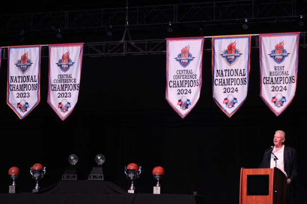 Amid championship banners and trophies, FireLake Arena General Manager David Qualls speaks during the Potawatomi Fire 2024 TBL Championship Banquet &amp; Ring Ceremony on Jan. 17. Countywide &amp; Sun/Natasha Dunagan