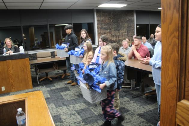 Shawnee students presented the Shawnee Board of Education with gift baskets during the regular Jan. 6 meeting. Countywide &amp; Sun/Natasha Dunagan