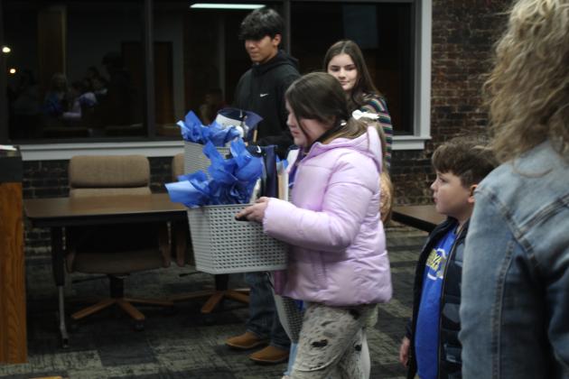 Shawnee students presented the Shawnee Board of Education with gift baskets during the regular Jan. 6 meeting. Countywide &amp; Sun/Natasha Dunagan