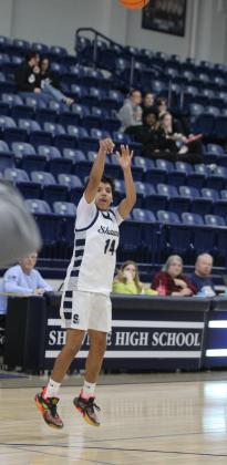 Shawnee sophomore Angel Avitia tries for a three-pointer during the Shawnee Invitational game with Southeast on Jan. 23. Countywide &amp; Sun/Natasha Dunagan