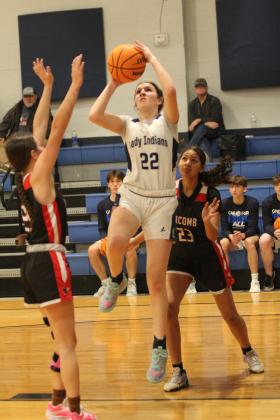 Asher's Makenah Templeton aims her jump shot during the Jan. 28 home game with Macomb. The Lady Indians won, 62-41, and the Indians shared in victory later, 66-30. Countywide &amp; Sun/Natasha Dunagan