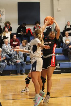 Macomb's Mackenzie Brummett prepares to make a bucket during the Jan. 28 game at Asher. The Lady Indians won, 62-41, and the Indians shared in victory later, 66-30. Countywide &amp; Sun/Natasha Dunagan
