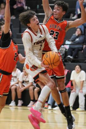 Maud junior Colt Abbot tries for a basket but is stopped by the Konawa defense during the home game on Jan. 28. Despite that, the Tigers won, 59-41, and the Lady Tigers won, 60-38, earlier. Countywide &amp; Sun/Natasha Dunagan