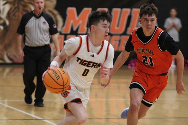 Maud sophomore Micah Brooks drives toward the hoop during the Jan. 28 home game with Konawa. The Tigers won, 59-41, and the Lady Tigers also beat Konawa, 60-38. Countywide &amp; Sun/Natasha Dunagan