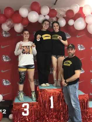 According to a Facebook post on Tecumseh Savage Wrestling, three girl wrestlers qualified for state, with one alternate. They are, from left, Kylei Gokey, who placed third in regionals, Trinity Rakestraw and Vivian Hayes, who placed first. Also shown is Wrestling Coach Billy Don Sigman. Lizzy Hernandez, not shown, is the alternate. Photo provided