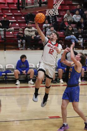 Earlsboro's Nate Ruiz steals the ball and tries for a bucket during the last regular season home game against Moss on Feb. 10. The Wildcats won, 69-50, and will play in the District tournament in Sasakwa, Feb. 14-15. Countywide &amp; Sun/Natasha Dunagan