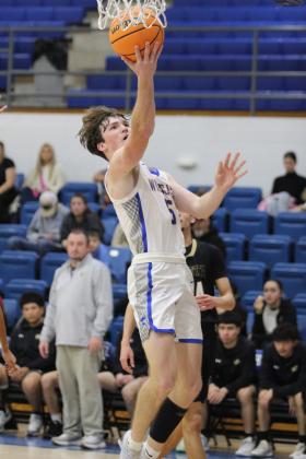 Bethel senior Zack Jennings makes a layup in the Class 3A District game with Marietta on Feb. 22. The Wildcats won, 67-41, and will play in regionals today at 7:30 pm at home. Countywide &amp; Sun/Natasha Dunagan