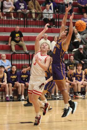 Dale junior Denton Forsythe encounters interference during the Class 2A Regional home game against Central (Sallisaw) on Feb. 24. The Pirates won, 83-43, and will advance to the area tournament on Feb. 28 in McAlester at 7:30 pm. Countywide &amp; Sun/Natasha Dunagan