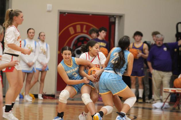 Dale senior Catelyn Edwards fights to keep possession of the ball in the Class 2A Regional home game with Oktaha on Feb. 24. The Lady Pirates won, 77-50, and they will advance to area in McAlester on Feb. 28 at 6 pm. Countywide &amp; Sun/Natasha Dunagan