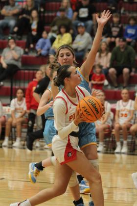 After stealing the ball, Dale senior Kaleigh Strange prepares to make a basket in the Class 2A Regional home game with Oktaha on Feb. 24. The Lady Pirates won, 77-50, and they will advance to area in McAlester on Feb. 28 at 6 pm. Countywide &amp; Sun/Natasha Dunagan