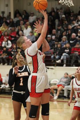 Earlsboro's Peighton Worley gets the rebound and the foul in the fourth quarter of the Class B Regional game with Wilson (Henryetta) on Feb. 21. The Lady Wildcats lost a close game with a final score of 50-54, and they ended their season in the second regional game with Strother, 50-68. Their record for the season was 19-7. The Wildcats won their first regional game against Haileyville, 61-30, and lost their second game to Carney, 51-54. Their record was 15-12.