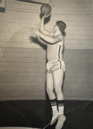 Bill Grogan aims for the bucket at the (now) old Tecumseh gymnasium in 1967. Grogan's 1968-69 basketball team was the first Tecumseh High School team to go to the state tournament under Coach Bob Avery. They lost in the quarterfinals to Pawhuska and ended their season with a record of 24-2. Photo provided.