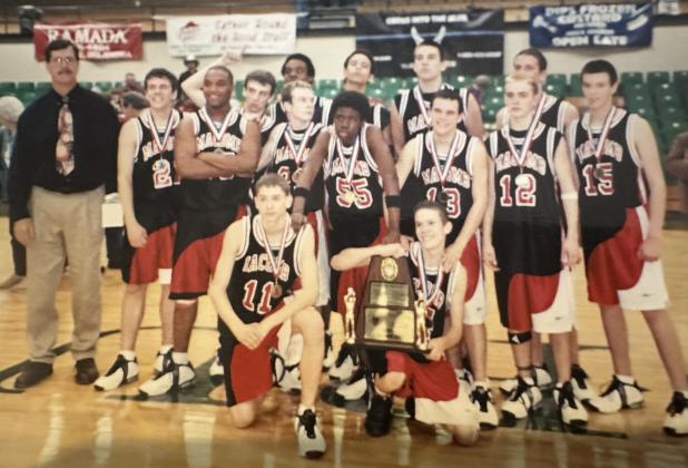 Coach Bill Grogan, far left, poses with his Macomb High School boys basketball team in 2005 after winning the Pottawatomie County Basketball Tournament Championship at OBU. As a Class B team, they beat Dale, McLoud and Tecumseh and went on to play in the State Semifinals. Photo provided.