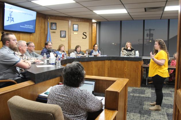 JTA Principal Hannah Holland speaks with the Board.