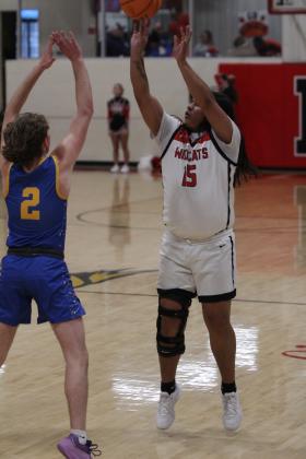Earlsboro senior Quintin Lena sinks a three-pointer in the last regular season home game against Moss on Feb. 10. The Wildcats won, 69-50, and will play in the District tournament in Sasakwa, Feb. 14-15. Countywide &amp; Sun/Natasha Dunagan