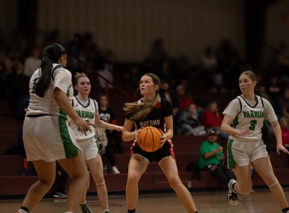 Surrounded by Varnum defenders, Macomb's Addy Beauchamp looks for an opening.