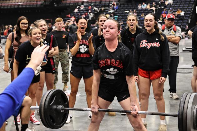 North Rock Creek girls cheer on Molly Campbell as she lifts 345 lbs. Her personal best. She finished first in her weight class. Photo courtesy of Gowin Photography
