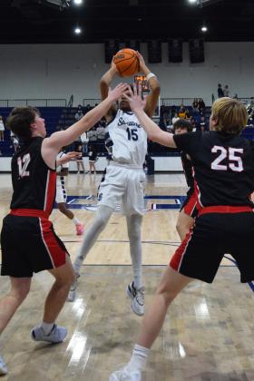 Rah'Mel Slaughter makes the shot in the first quarter of the homecoming game against Bishop Kelley. The Wolves lost 46-52. Countywide &amp; Sun/Julie Talton
