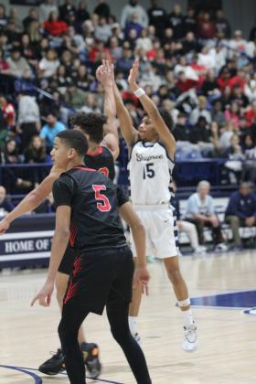 Shawnee sophomore Rah'mel Slaughter shoots for three during the Feb. 8 home game against North Rock Creek. The Wolves lost, 53-61. Countywide &amp; Sun/Natasha Dunagan