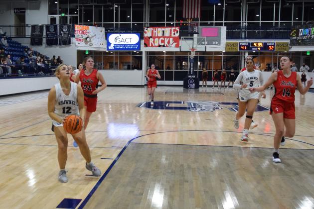 Abigail Clements shoots for two in the homecoming game against Bishop Kelley on Jan 31. The Lady Wolves won the matchup 54 -33. Countywide &amp; Sun/Julie Talton