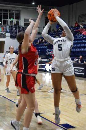 Chrishelle Milum puts two on the board in the homecoming game against Bishop Kelley. The Lady Wolves pulled out the victory 54-33. Countywide &amp; Sun/Julie Talton
