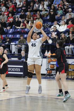 Shawnee freshman Karma Mason aims for the bucket during the Feb. 8 home game against North Rock Creek. The Lady Wolves lost, 46-59. Countywide &amp; Sun/Natasha Dunagan