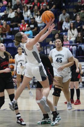 Shawnee senior Josie Megehee tries for a jump shot and is fouled in the Feb. 8 home game against North Rock Creek. The Lady Wolves lost, 46-59. Between the boys and girls varsity games, Megehee was recognized for reaching 2,000 career points recently. Countywide &amp; Sun/Natasha Dunagan