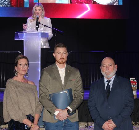 Officer Lance Biswell receives a Life-Saving Award during the 20th Annual "Celebration of Heroes" Shawnee Police Foundation Awards Banquet on Jan. 31 at the Grand Casino Hotel and Resort. Biswell responded to an injury accident and treated a victim with a leg injury who was on blood thinners. He applied gauze and pressure and kept monitoring the victim, realizing when a tourniquet was necessary and using that. Also shown are SPF Chair Melissa Stuteville, left, and Deputy Chief John Goss.