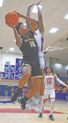 Tecumseh's Jekhi Owens puts up a jump shot in the Jan. 31 game at Chandler. The Savages lost, 52-76. Photo courtesy of Brian Blansett.