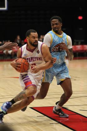 Potawatomi Fire Guard Deshawn Munson guards the ball on his way to the paint during the third quarter of the March 23 home game with the San Antonio Clutch. The Potawatomi Fire website stated that Munson sank 22 points and had 13 rebounds for his third double-double this season. The Fire won, 133-99. Their next home game at FireLake Arena will be on April 10 at 7 pm. Natasha Dunagan, Countywide &amp; Sun