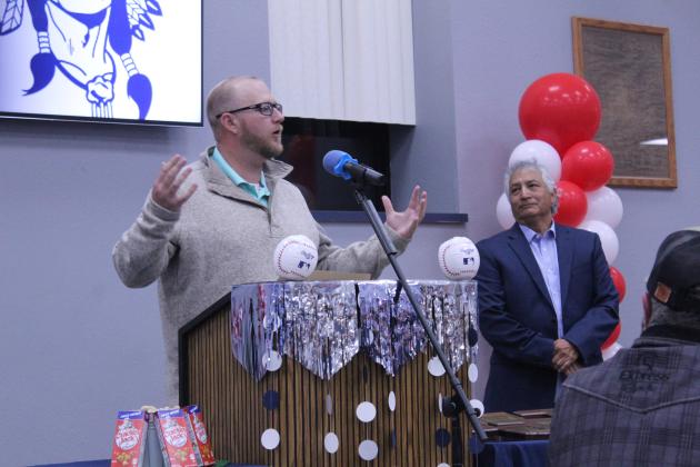 Asher Baseball Booster Club President Justin Thompson speaks at the First Annual Asher Baseball Spring Kickoff and Hall of Fame Banquet, held at the Asher Public Schools cafeteria on March 8, as Head Baseball Coach David Rolette listens. There were 10 alumni who were inducted into the Hall of Fame. Countywide &amp; Sun/Natasha Dunagan