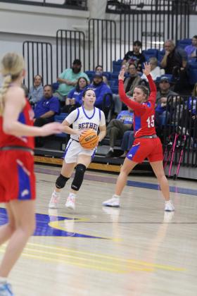 In the last second of the third quarter, Bethel junior Ava Gascon prepares to sink a half-court shot in the Class 3A Regional Tournament game with Chandler on Feb. 27. The Lady Wildcats won, 52-44, but lost their second regional game against Washington on March 1, 30-74. They will begin area play against Atoka in Ada today (March 6) at 6 pm. Countywide &amp; Sun/Natasha Dunagan