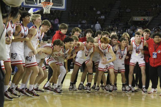 The Dale Pirates Basketball Team prepares to run up and claim the golden basketball trophy after winning the OSSAA Class 2A Basketball State Championship on March 8 at the State Fair Arena. The Pirates won against Cashion on March 6, 74-55; Fairland on March 7, 76-51; and, Pocola on March 8, 60-20, to take state for the fourth year straight. They end the season with a record of 30-2. Natasha Dunagan, Countywide &amp; Sun