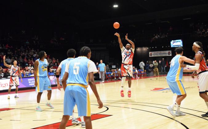 Paul Harrison sinks a three in the second half of the home opener of the Potawatomi Fire on Mar. 8.  The Fire lit up the court with a 126-81 win against the Western Oklahoma Sky Kings.