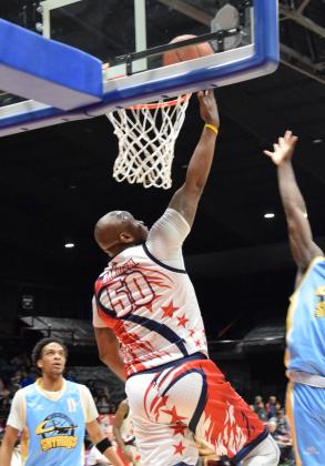The Potawatomi Fire's Paul Harrison sits the ball in the basket in the home opener on Mar. 8. The Fire lit up the court with a 126-81 win against the Western Oklahoma Sky Kings.